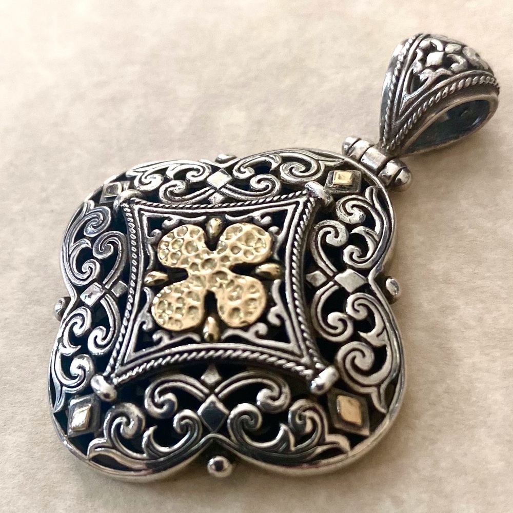 Sterling Silver medallion style pendant with 14K gold accent.
